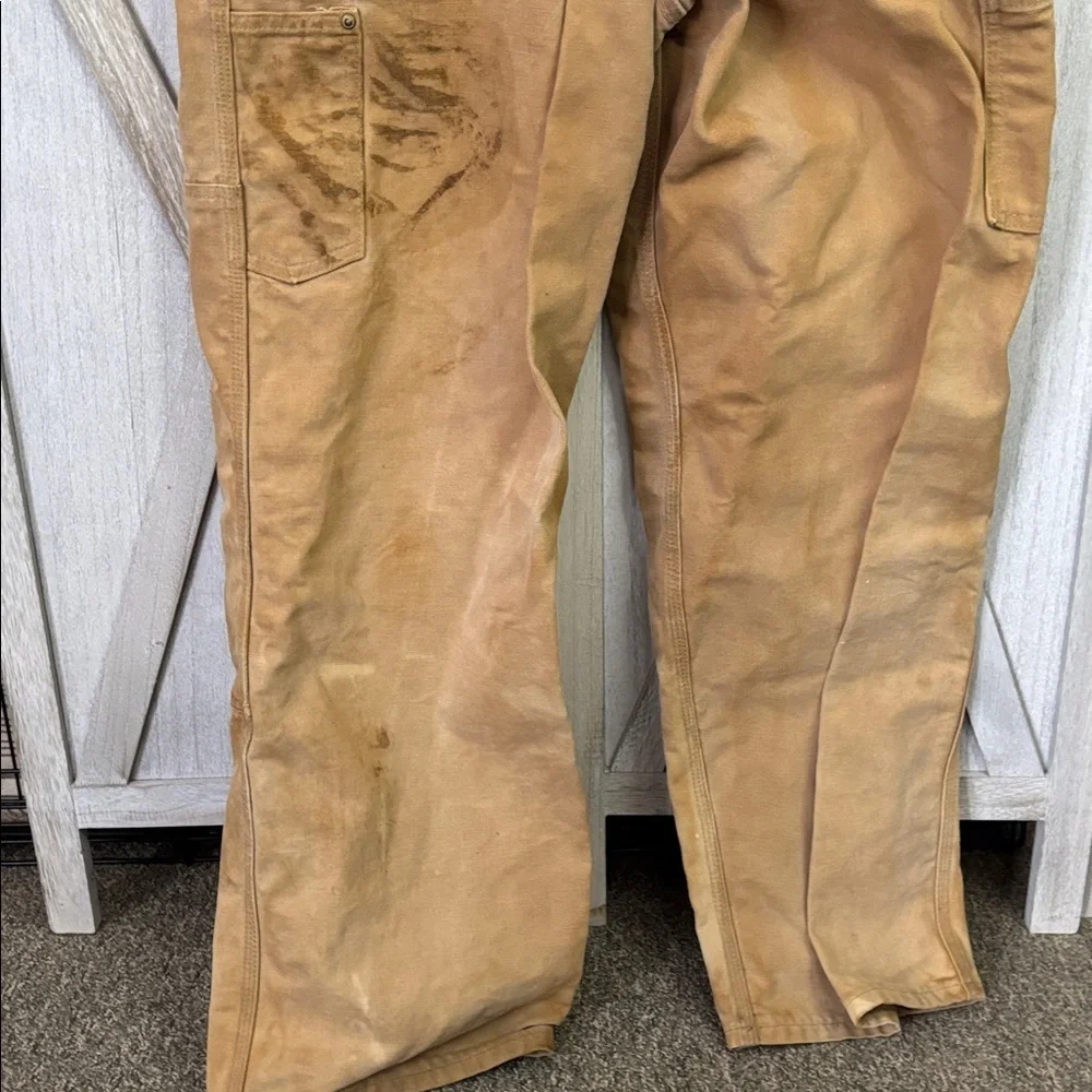Thrashed vintage 80s or 90s carhartt unlined beige double knee duck overall bibs